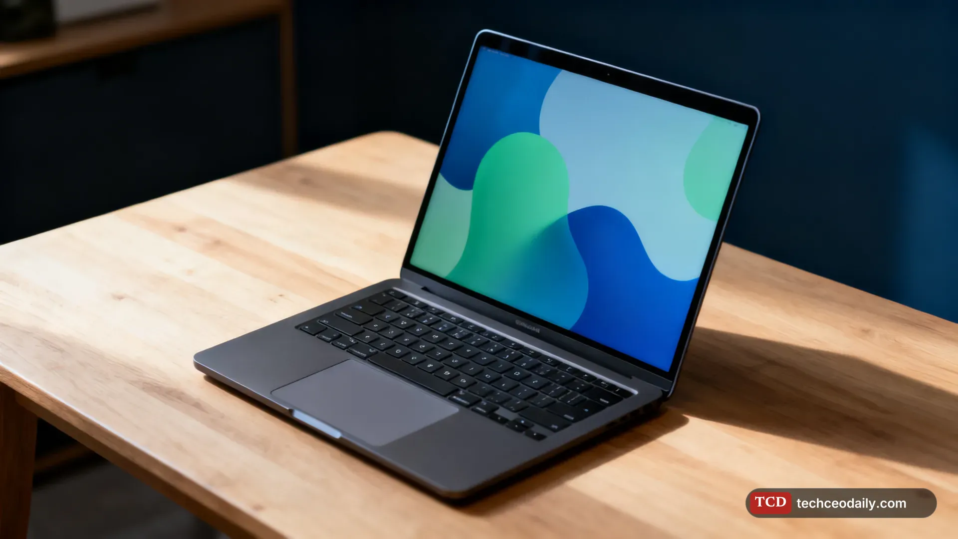 A thin generic silver laptop open on a clean white desk