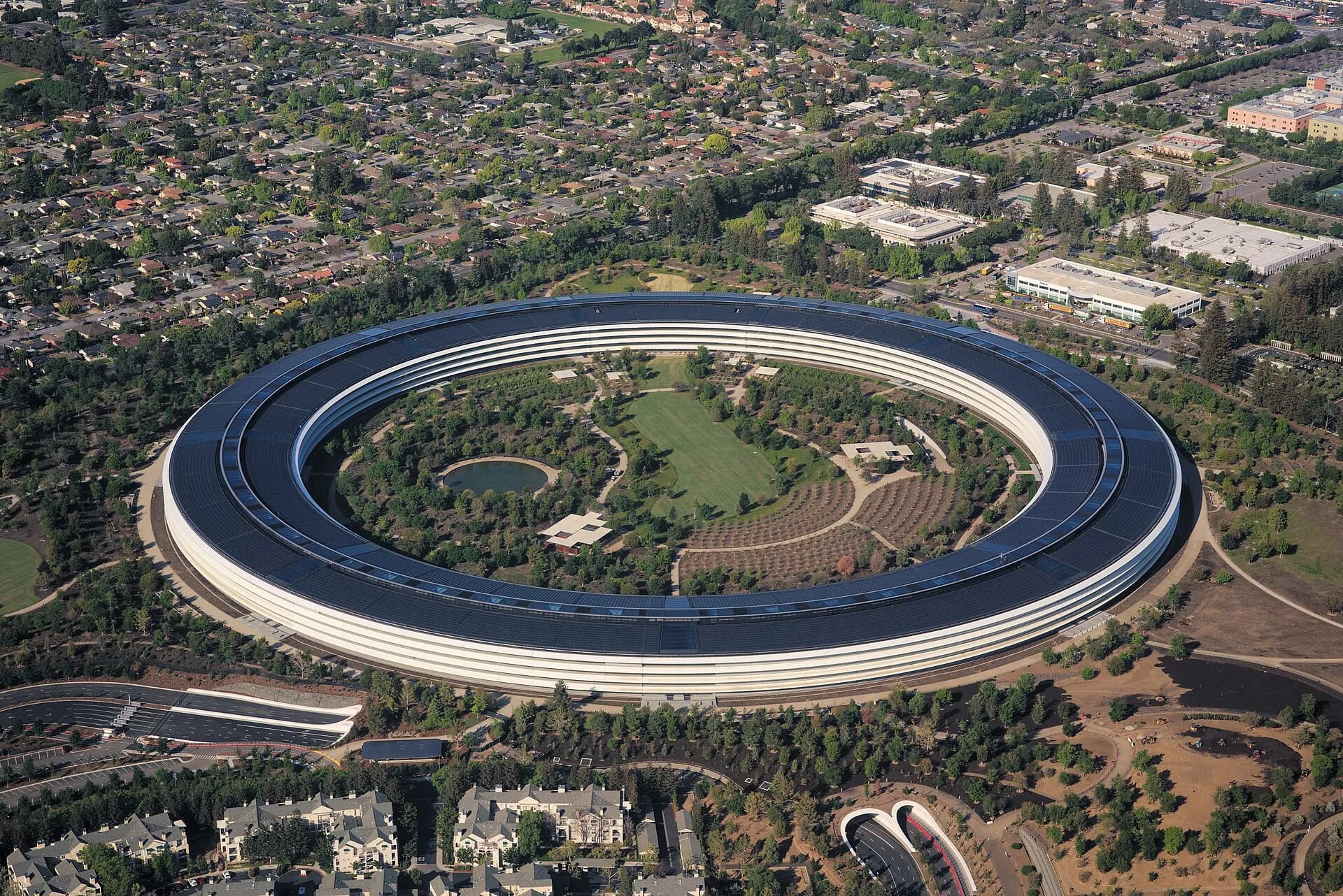 Aerial view of Apple Park, Apple's headquarters in Cupertino, California, with its solar-panel roof