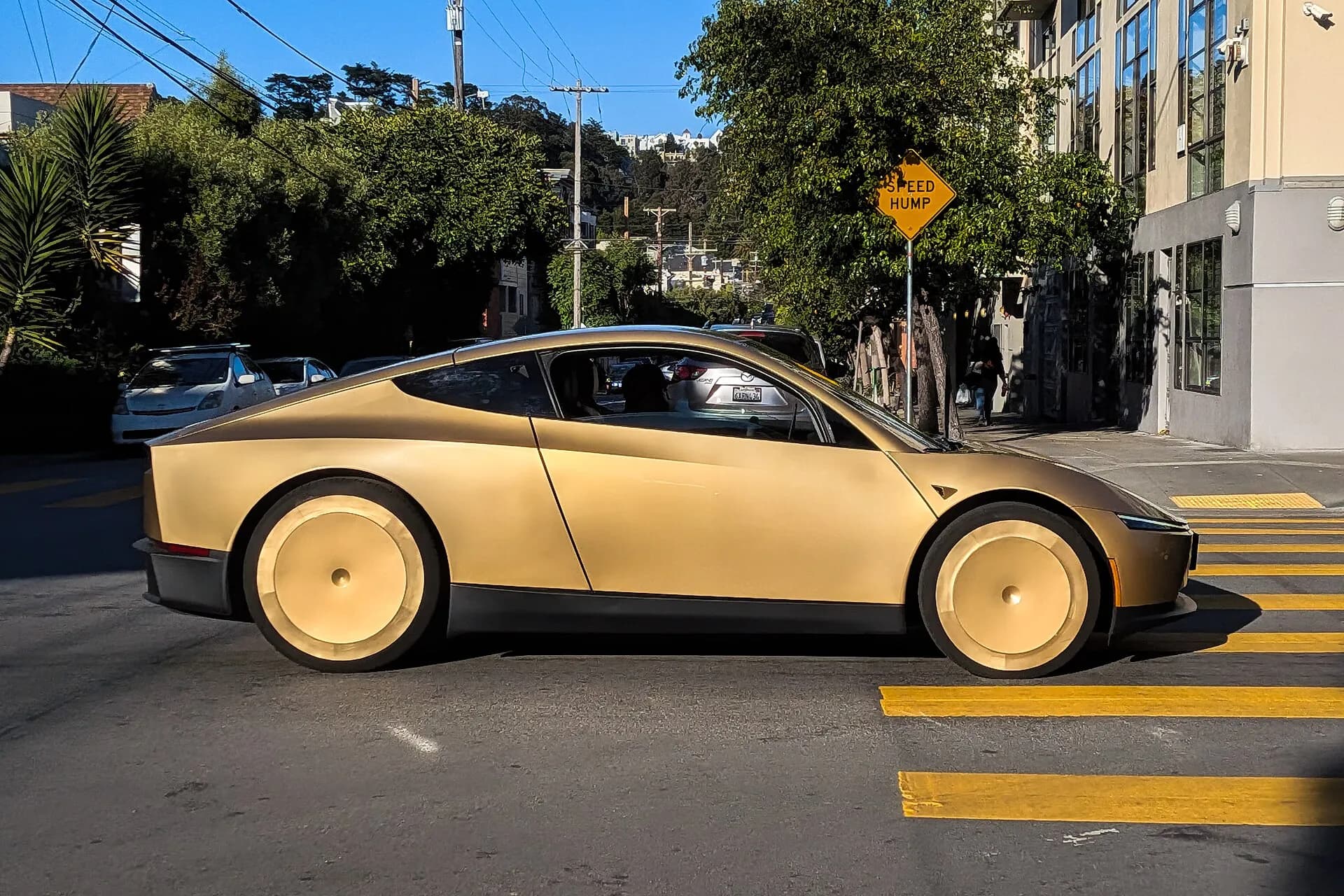 A Tesla Cybercab drives down Harrison St. in San Francisco in June 2026.