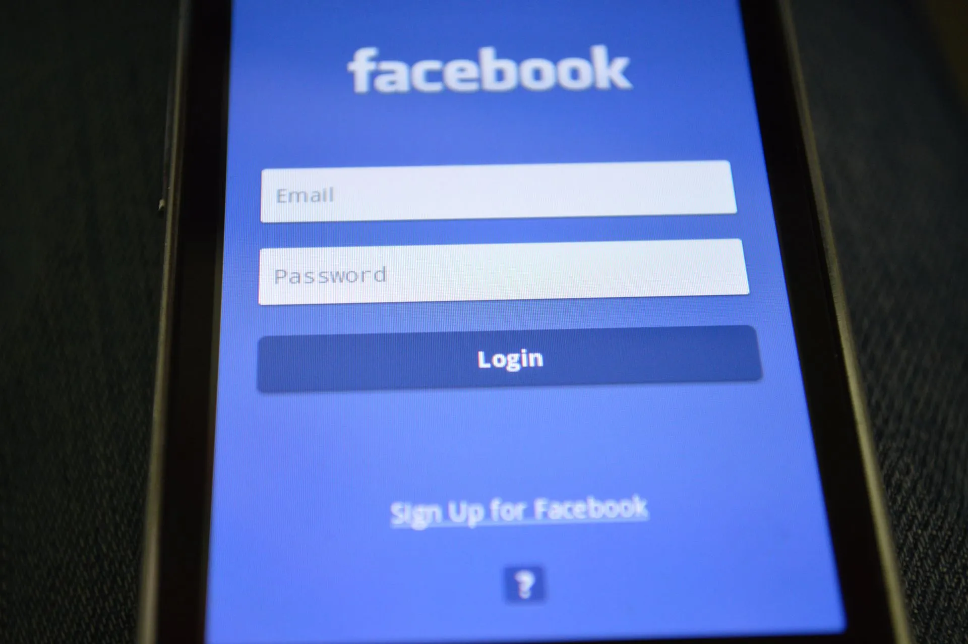 Close-up of a smartphone screen showing the Facebook login interface, illustrating OpenAI agent's Medicare portal incident puts AI agent security on the board agenda