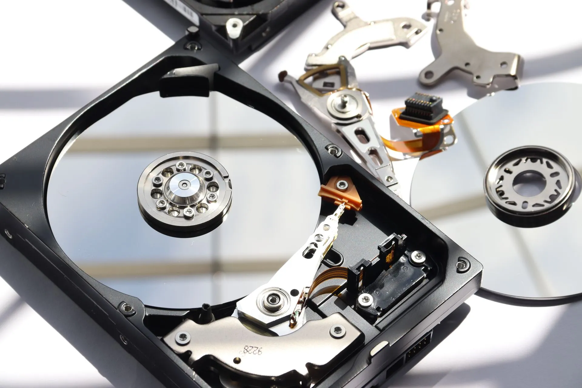Detailed view of disassembled HDD showing intricate internal components, illustrating AI-ready data push