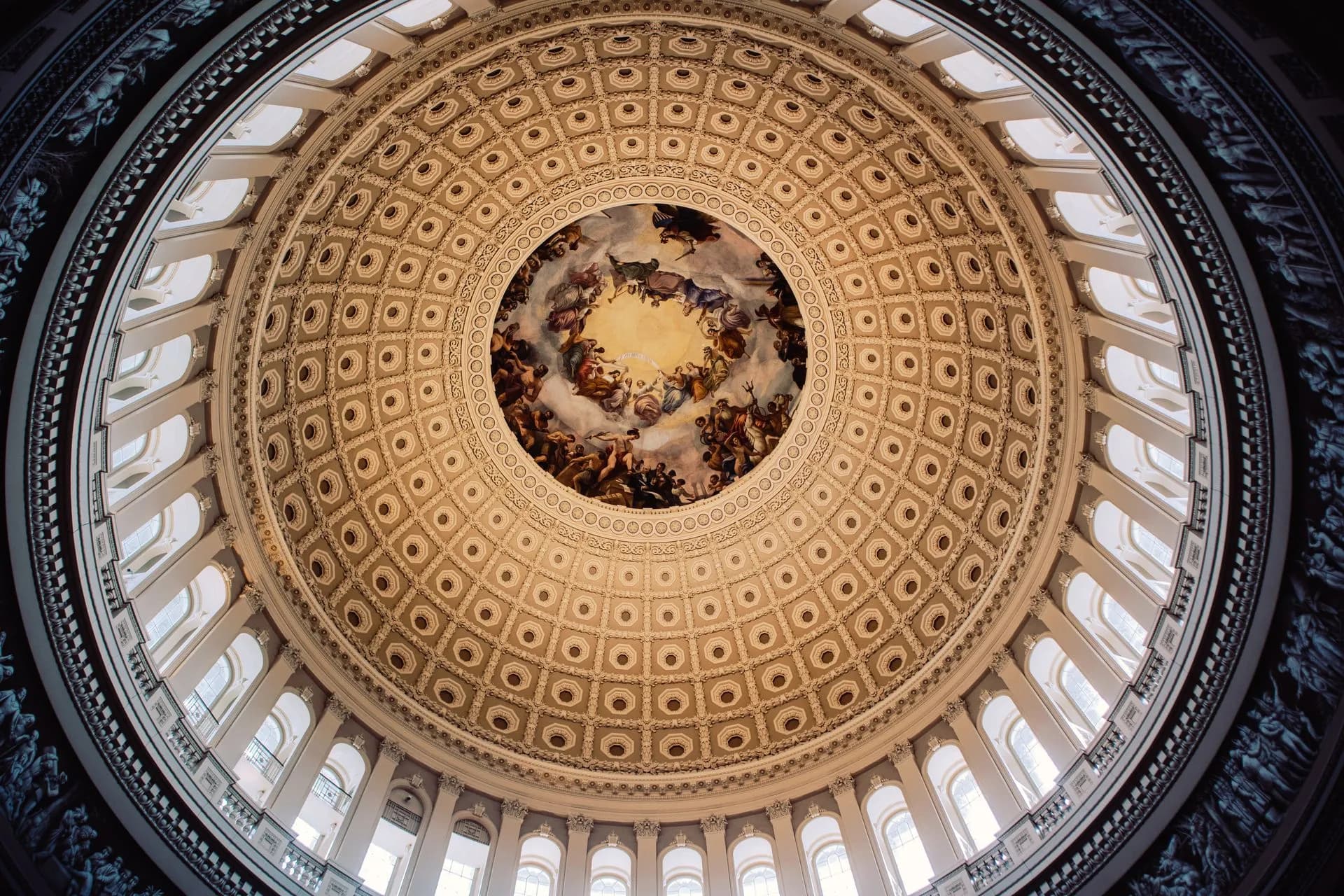 Stunning view of the United States Capitol Rotunda's ornate dome from below, illustrating America.gov launches with Google's Gemini and Musk's Grok answering citizens' questions