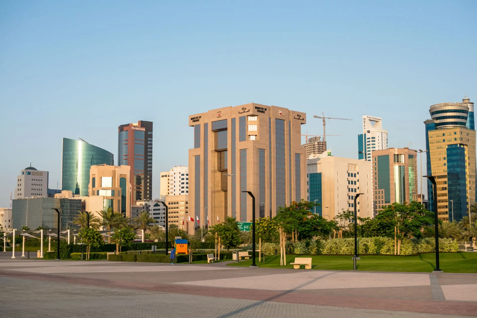 Skyline view of Bahrain's Diplomatic Area showcasing modern architecture and skyscrapers under a clear day sky, illustrating AWS Bahrain region loss shows multi-zone cloud design
