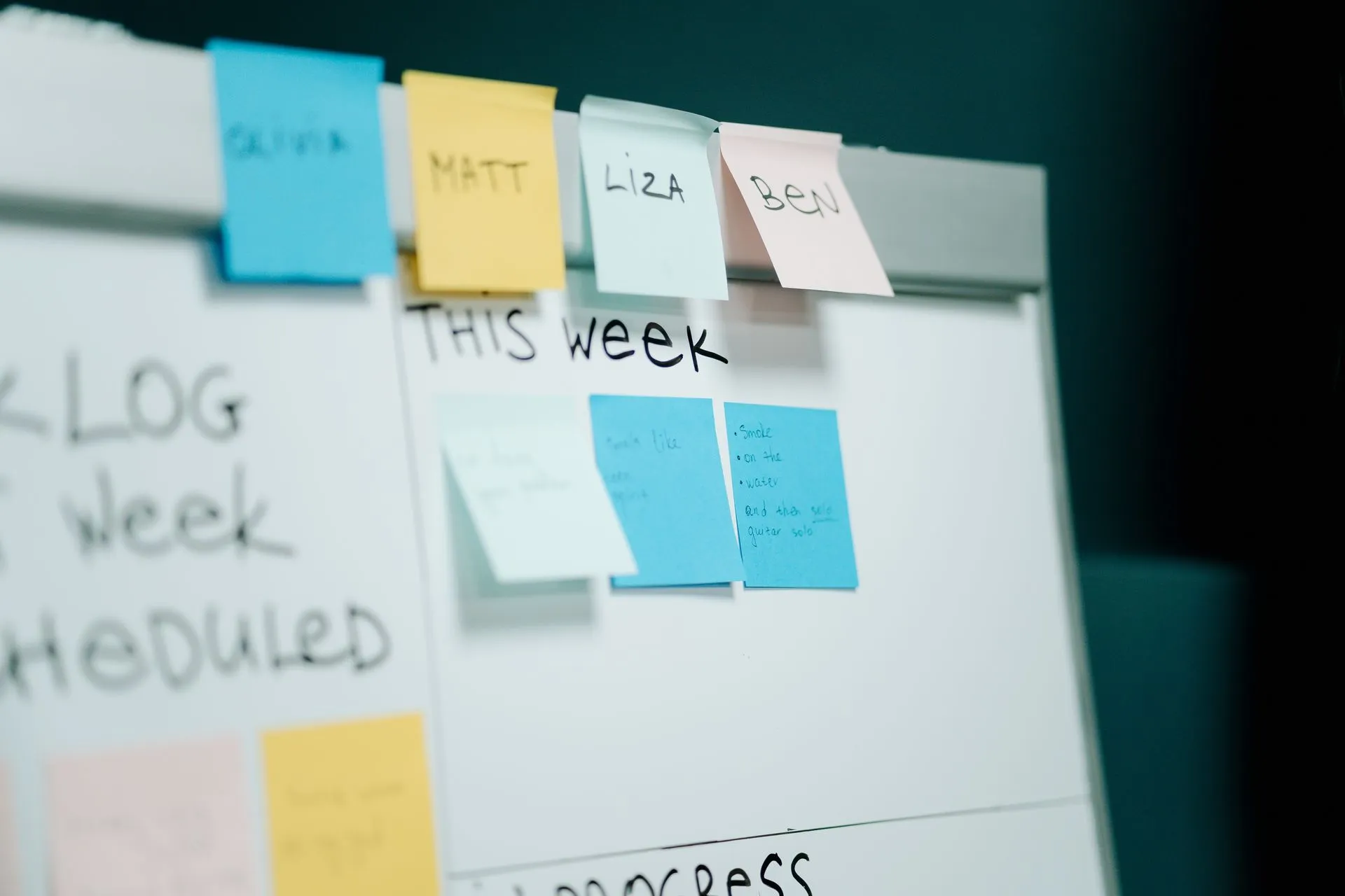 Close-up of a whiteboard with colorful sticky notes for task organization and planning, illustrating Bending Spoons' $1.36 billion Miro acquisition puts customer contracts in focus