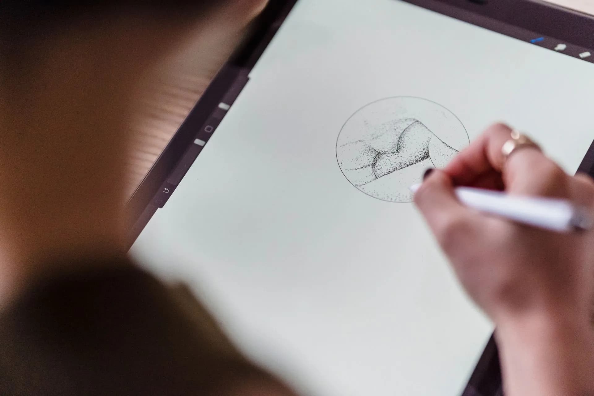 From above of crop anonymous artist with stylus in hand drawing creative sketch on graphics tablet, illustrating Black Forest Labs FLUX 3 Image brings native 4K generation and editing