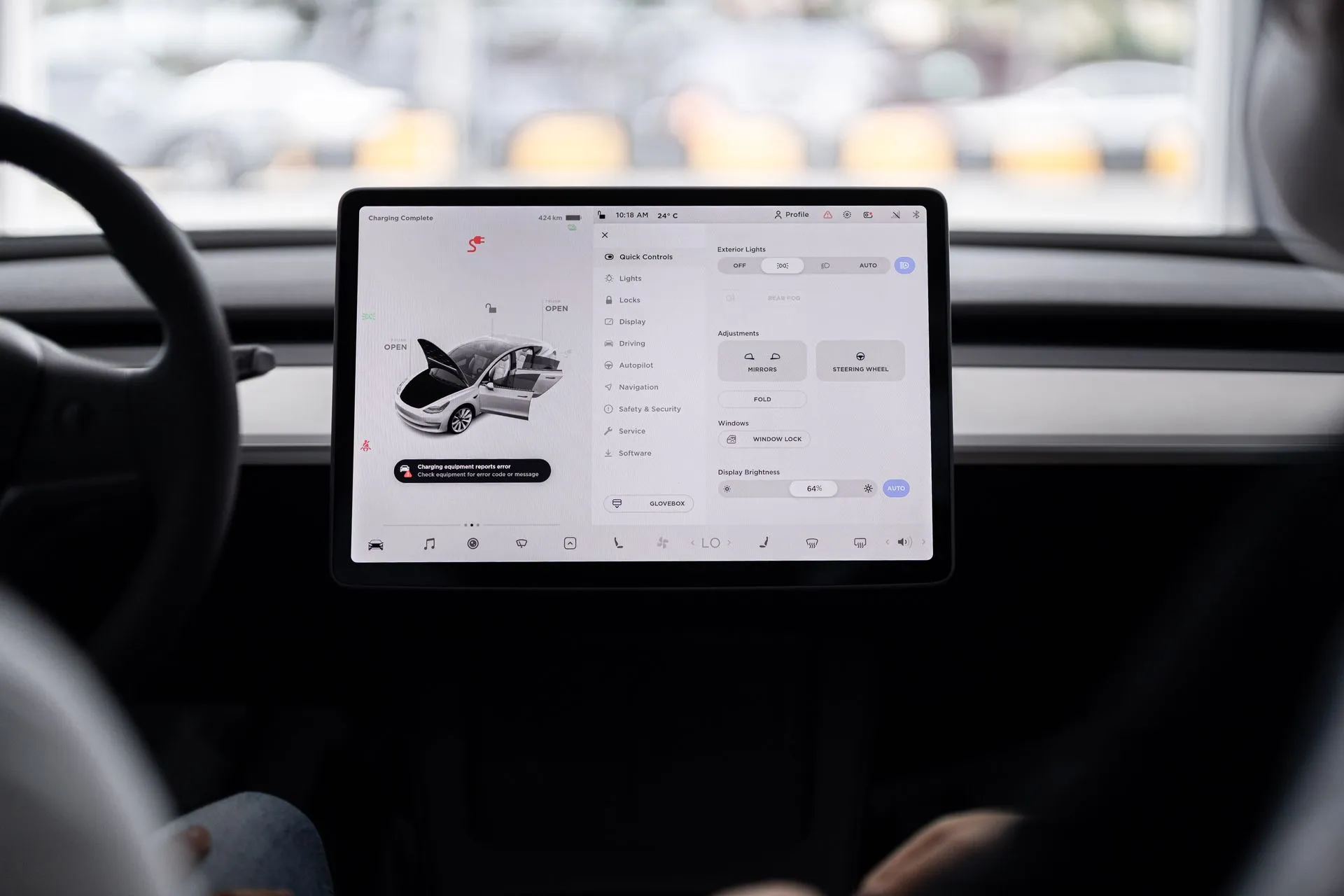 View of a modern car's dashboard featuring a digital display panel with control options, illustrating Car data privacy study finds 28 of 30 automaker apps sent data to outside firms
