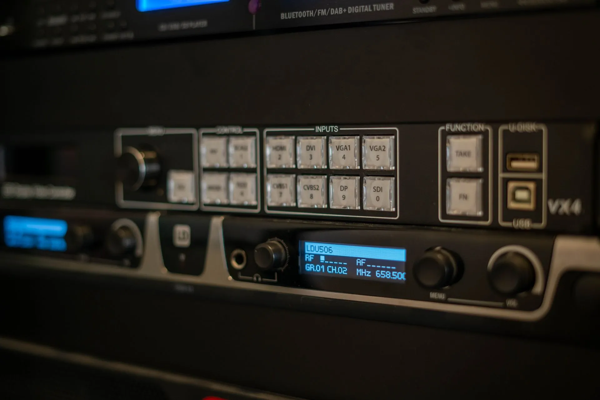 Detailed view of audio equipment showing inputs and digital controls in a studio setting, illustrating Cisco discloses five critical Nexus switch flaws that could allow remote root