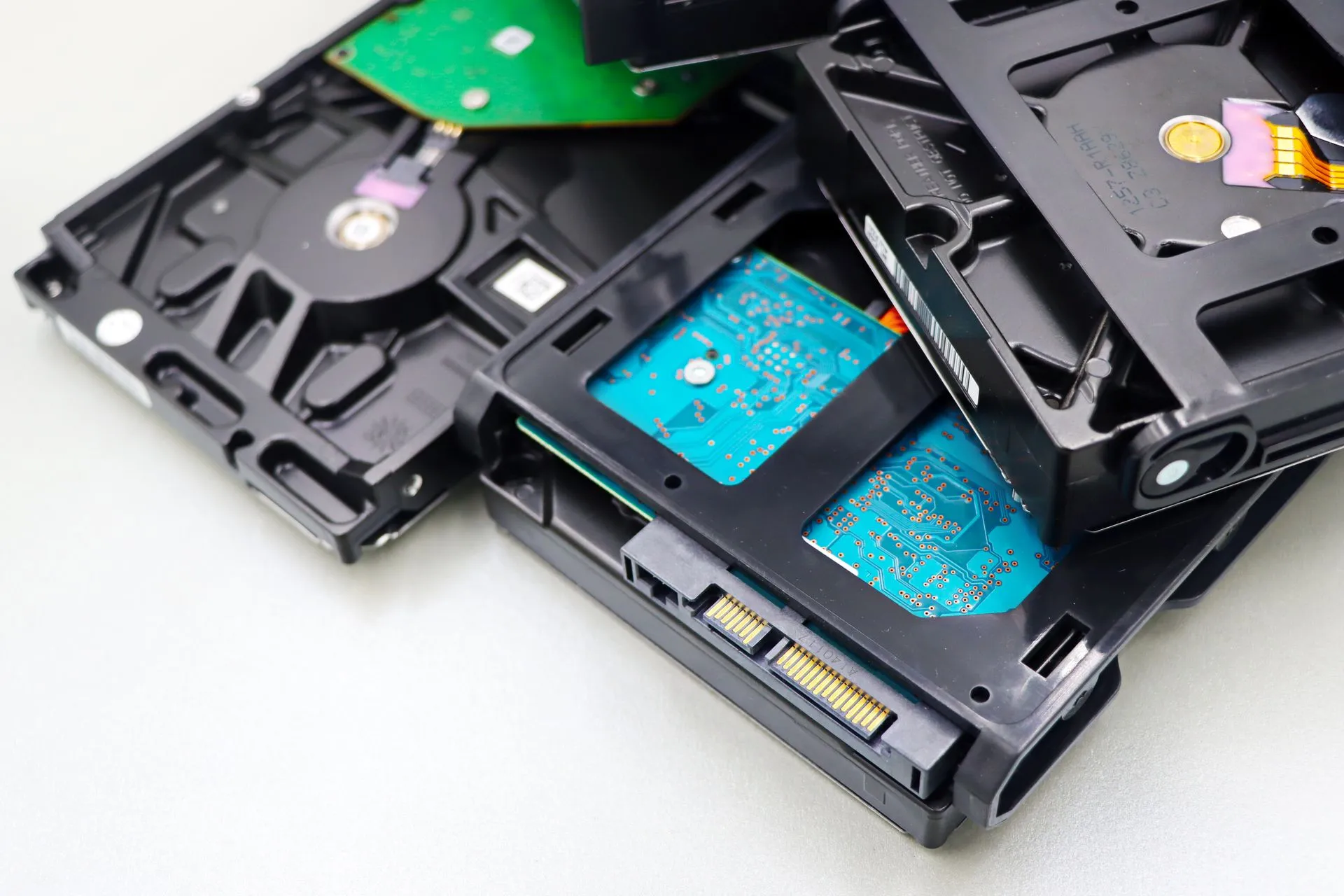 Stack of internal hard disk drives for digital storage on white background, illustrating DeepInfra says ARR tops $105 million, up nearly 14x, as it serves 22 trillion tokens a week