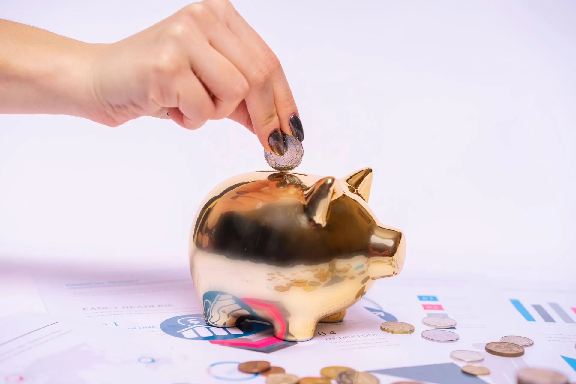 A hand places a coin into a golden piggy bank surrounded by financial documents, symbolizing savings, illustrating Michael Dell says family's $250 gifts have reached 10 million Trump