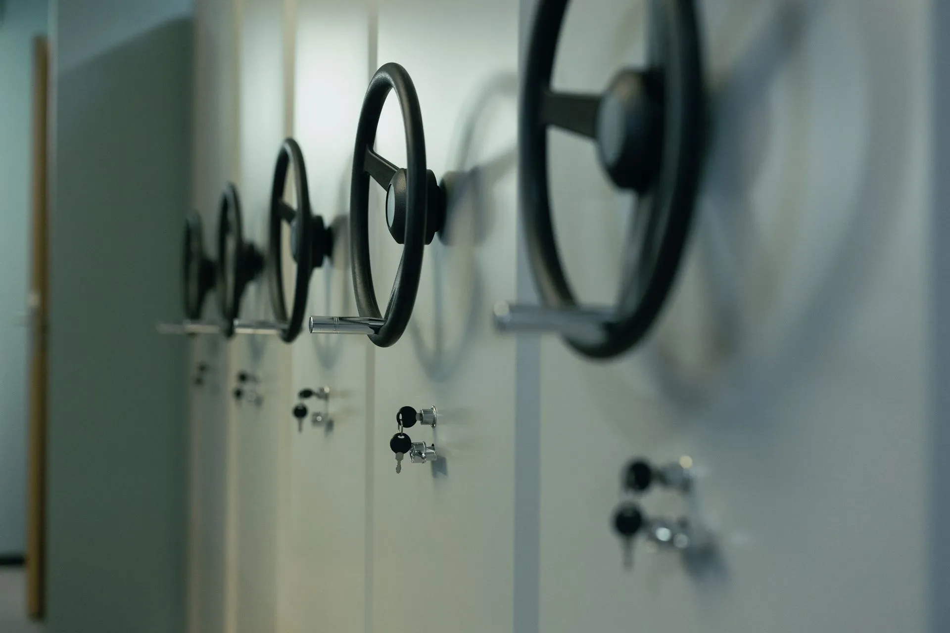 Close-up of industrial safes with manual locks and keys, highlighting security features, illustrating Fintech bank charter race heats up as Enova quits