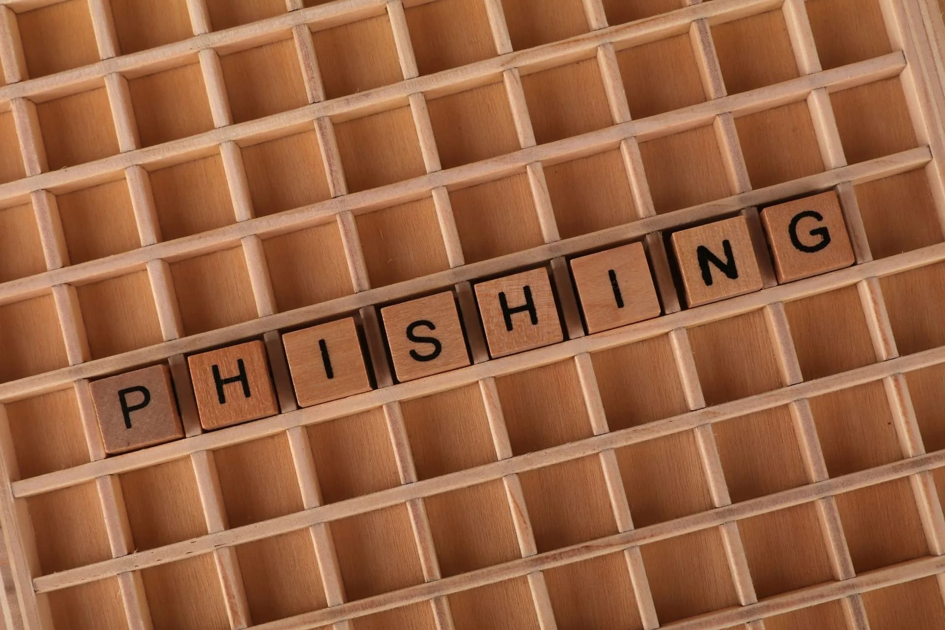 Wooden Scrabble tiles arranged to spell 'Phishing', illustrating online security concepts, illustrating FortiMail zero-day rated 9.8 under active attack lets hackers write files with