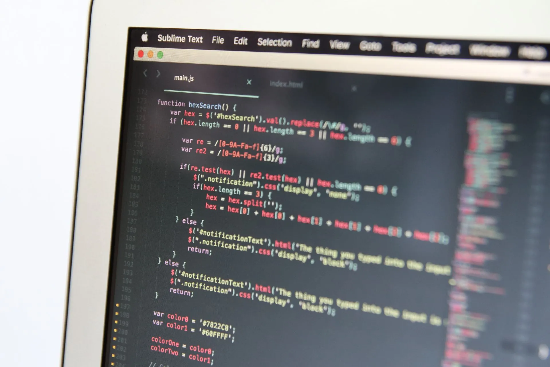 Close-up image showing JavaScript code on a computer screen, reflecting modern programming work, illustrating GitLab AI Gateway vulnerability rated 9.9 as Truffle finds 543,699 live