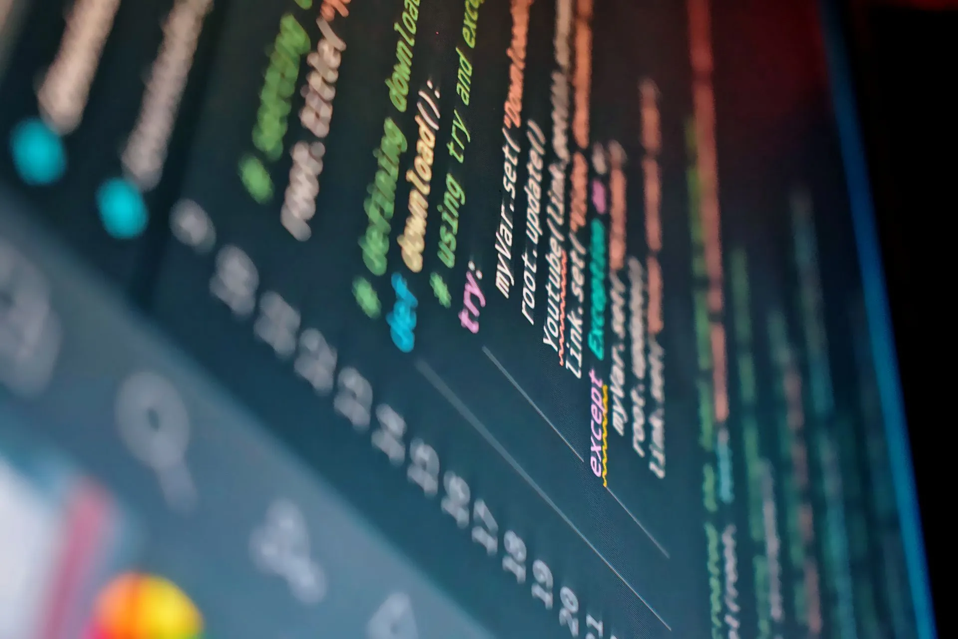 Vibrant close-up of a computer screen displaying color-coded programming code, illustrating Harness acquires Augment Code's Cosmos coding agent and team to link coding with delivery