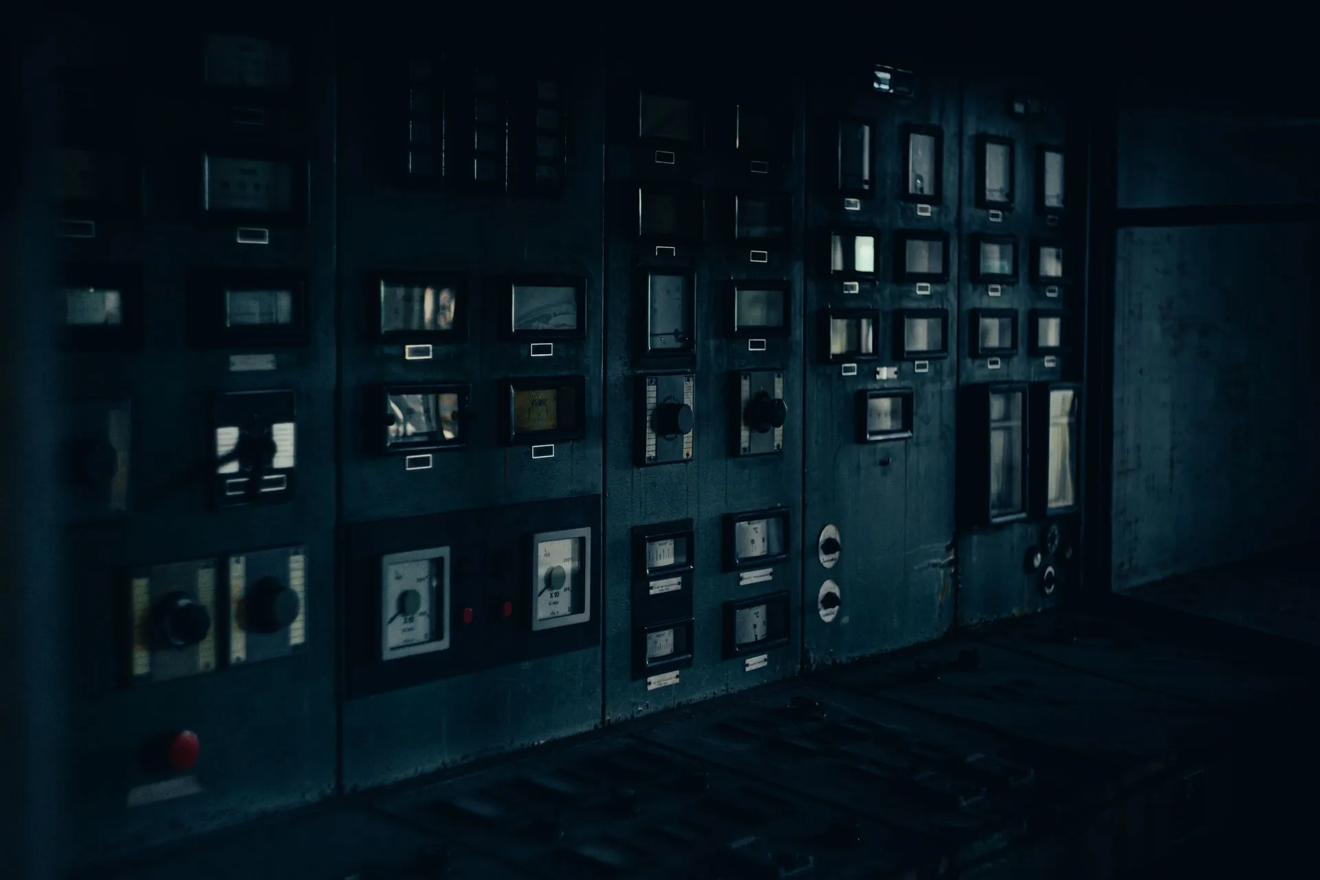 A dark, retro industrial control panel with dials and gauges in a maintenance room, illustrating KillSec ransomware takedown