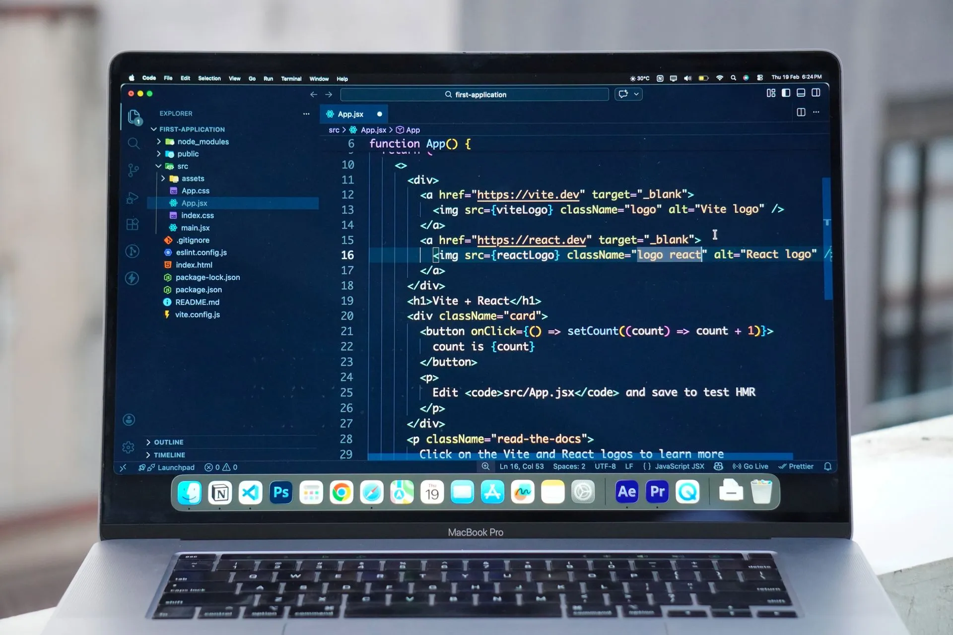 A MacBook Pro displaying code editor on a rooftop setting in daylight, ideal for a remote work lifestyle, illustrating Lovable annualized revenue tops $600 million as apps move into
