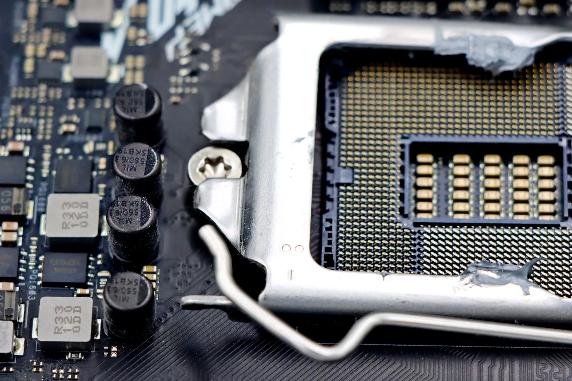 Detailed close-up image of a CPU socket and components on a motherboard, illustrating Lunex stealer abuses a signed AMD driver to blind security tools, Ontinue says