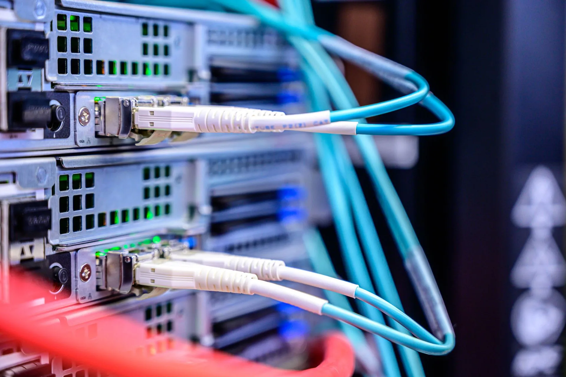 Detailed shot of Ethernet cables connected to server ports highlighting technology infrastructure, illustrating Microsoft Fabric ecosystem grows as ClickHouse, Atlan and Telmai