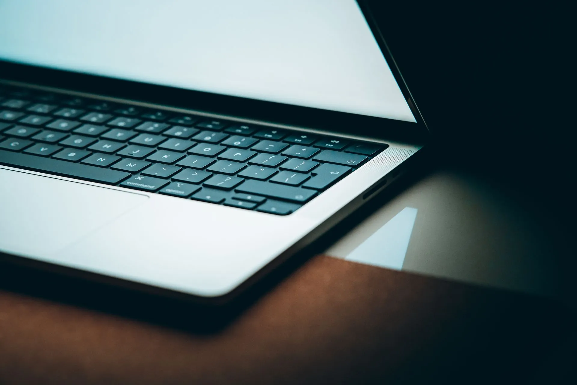 Close-up of a modern laptop keyboard with a backlit display, emphasizing sleek design, illustrating Microsoft Titan flaw gave a teen admin access to databases of an estimated 17.3T rows