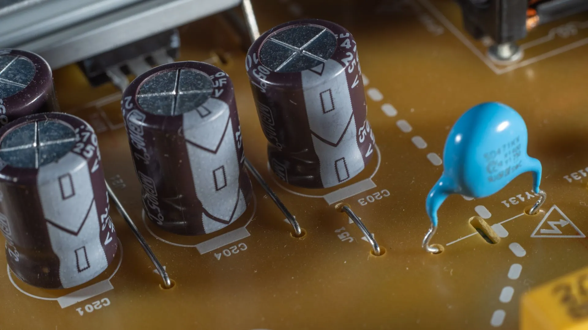 Detailed image showing capacitors on a printed circuit board, emphasizing technical components, illustrating Mistral Large 4 arrives as a 1 trillion-parameter open-weight model