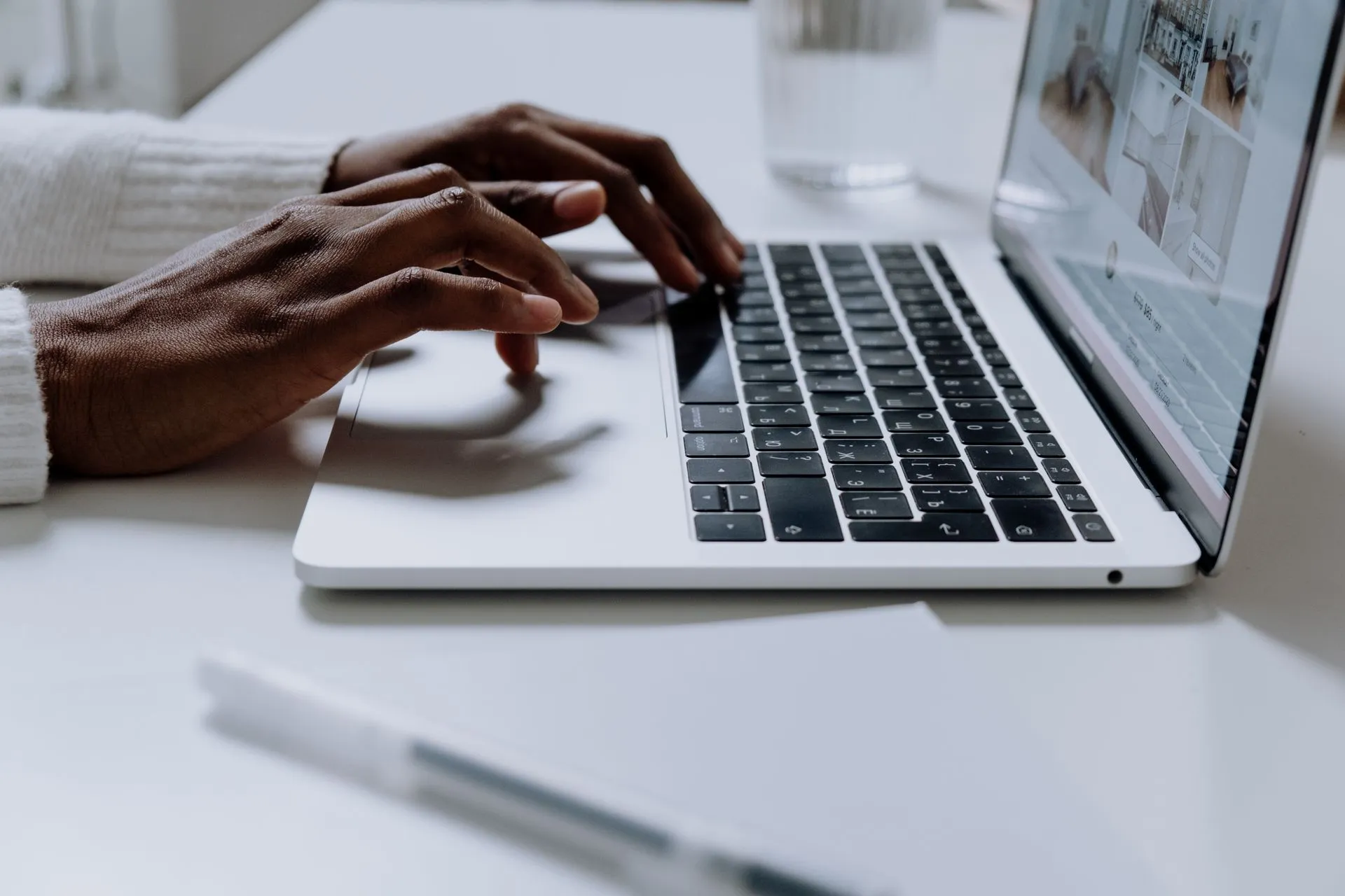 Hands typing on a sleek laptop keyboard, illustrating modern technology in use, illustrating Nikkei email hack