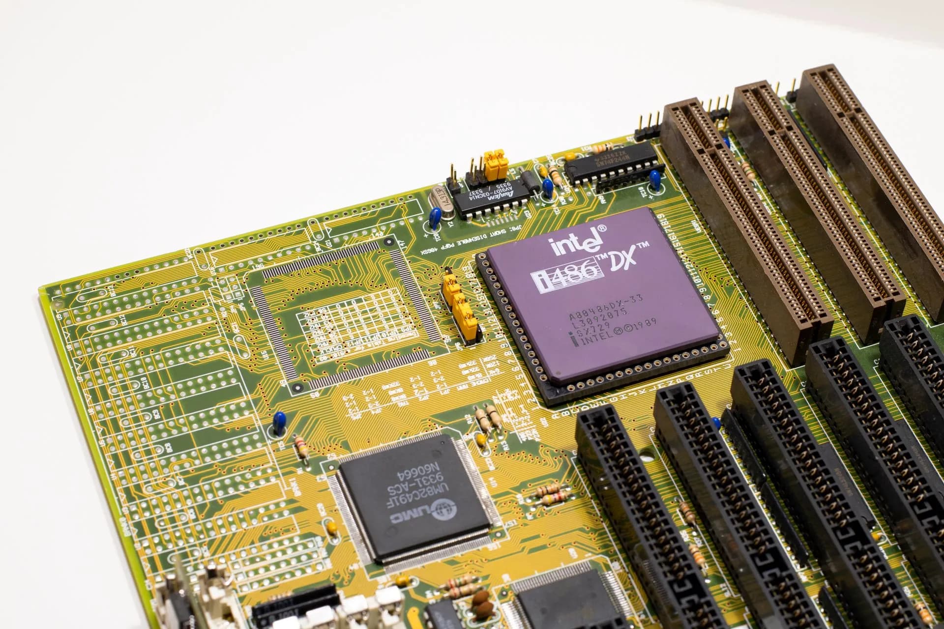 Close-up of a vintage Intel 486 CPU motherboard with PCI slots, highlighting retro technology components, illustrating Nous Research raises $90M Series B at $1.5B valuation with Nvidia