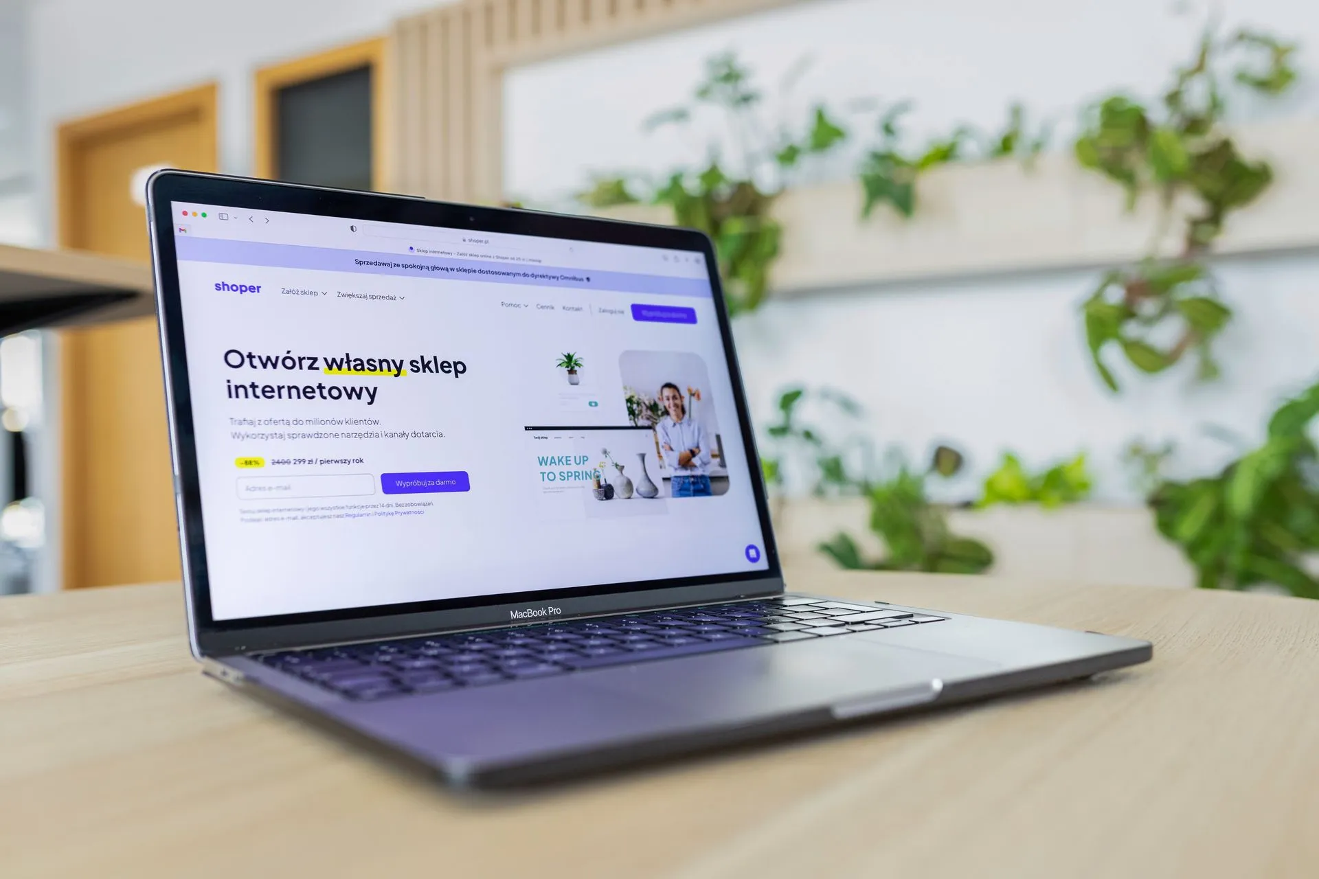 Close-up of a laptop with an open e-commerce website, surrounded by modern office decor, illustrating OpenAI found self-replicating prompt injections that made its test models copy the