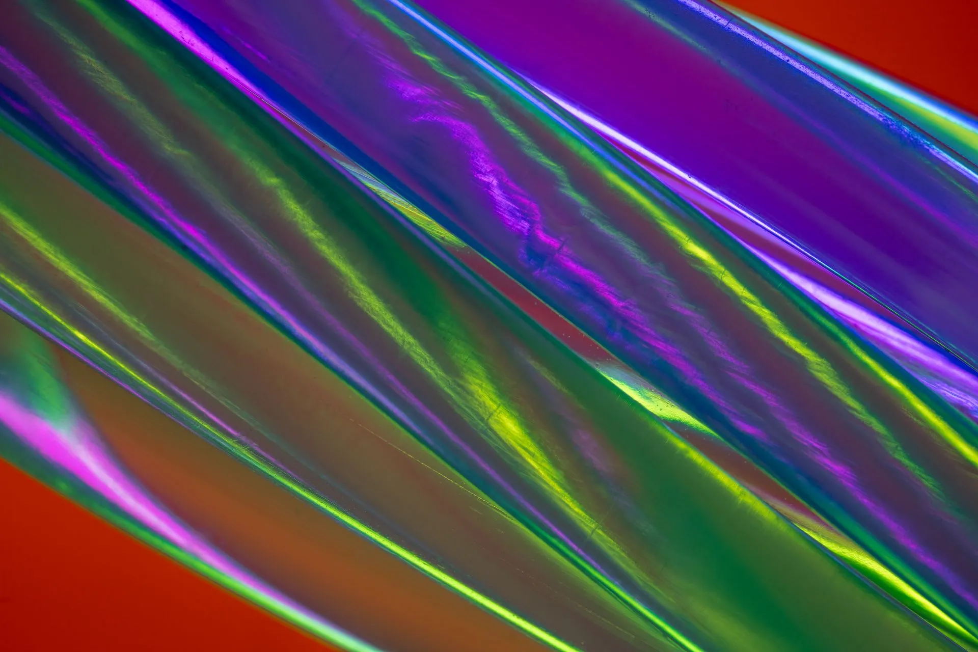 Dynamic abstract artwork featuring vivid translucent curves in vibrant colors and reflections, illustrating OpenAI and Synopsys sign multi-year GPT-Synopsys deal to build a chip-design