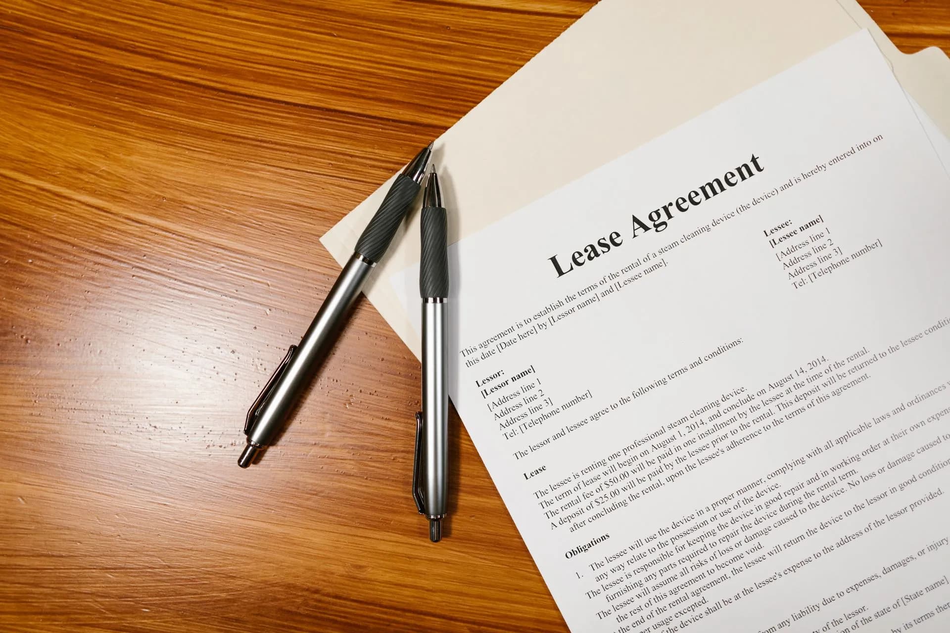 High-angle view of a lease agreement and pens on a wooden desk, illustrating OpenAI vendor risk rises with Florida injunction bid, AISI tests, canceled GPT-6.1 Astra
