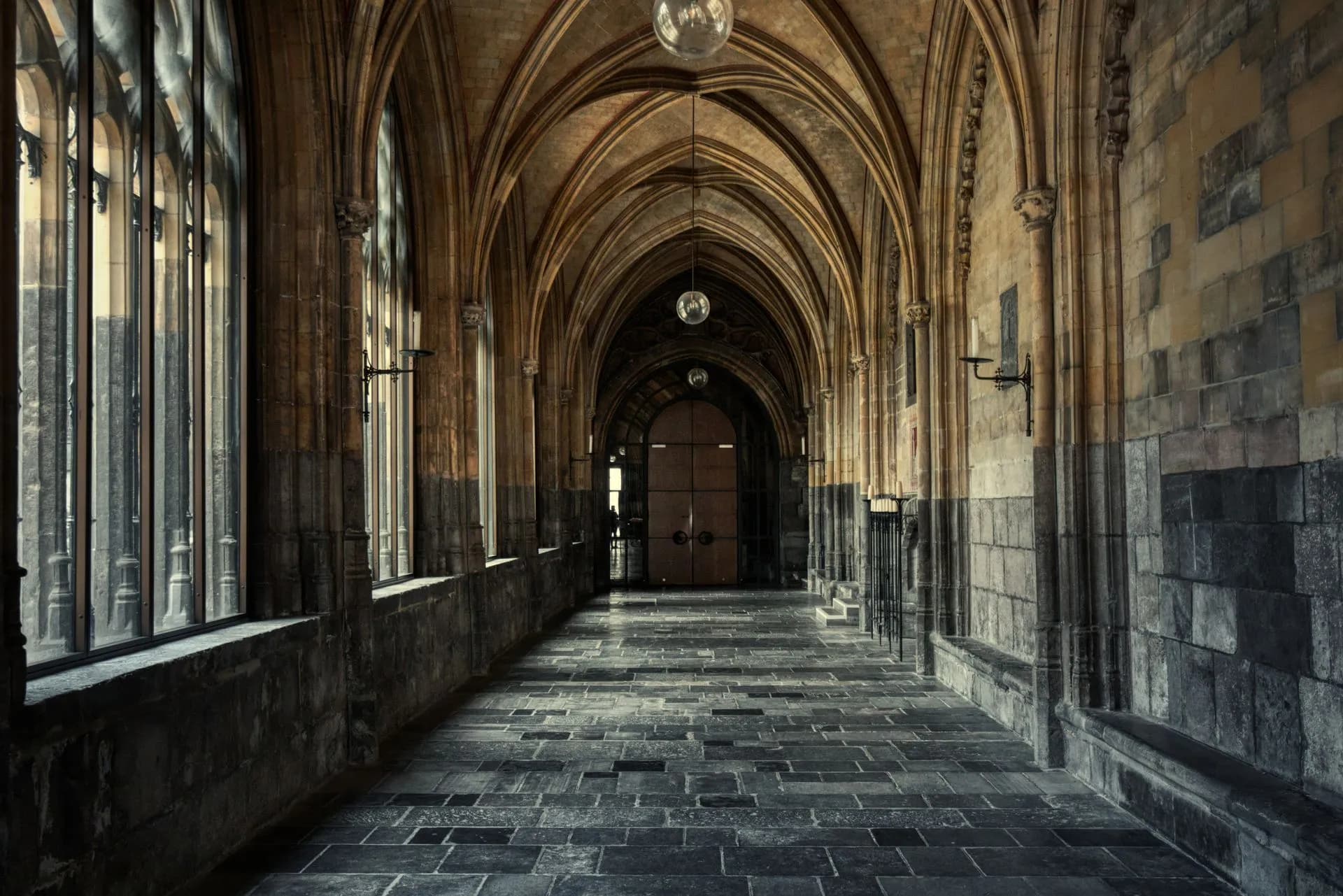 Explore the serene Gothic architecture of a cathedral hallway with elegant arches, illustrating OppFi bank deal under fire as Warren and Van Hollen urge it to drop $130M BNCCORP bid