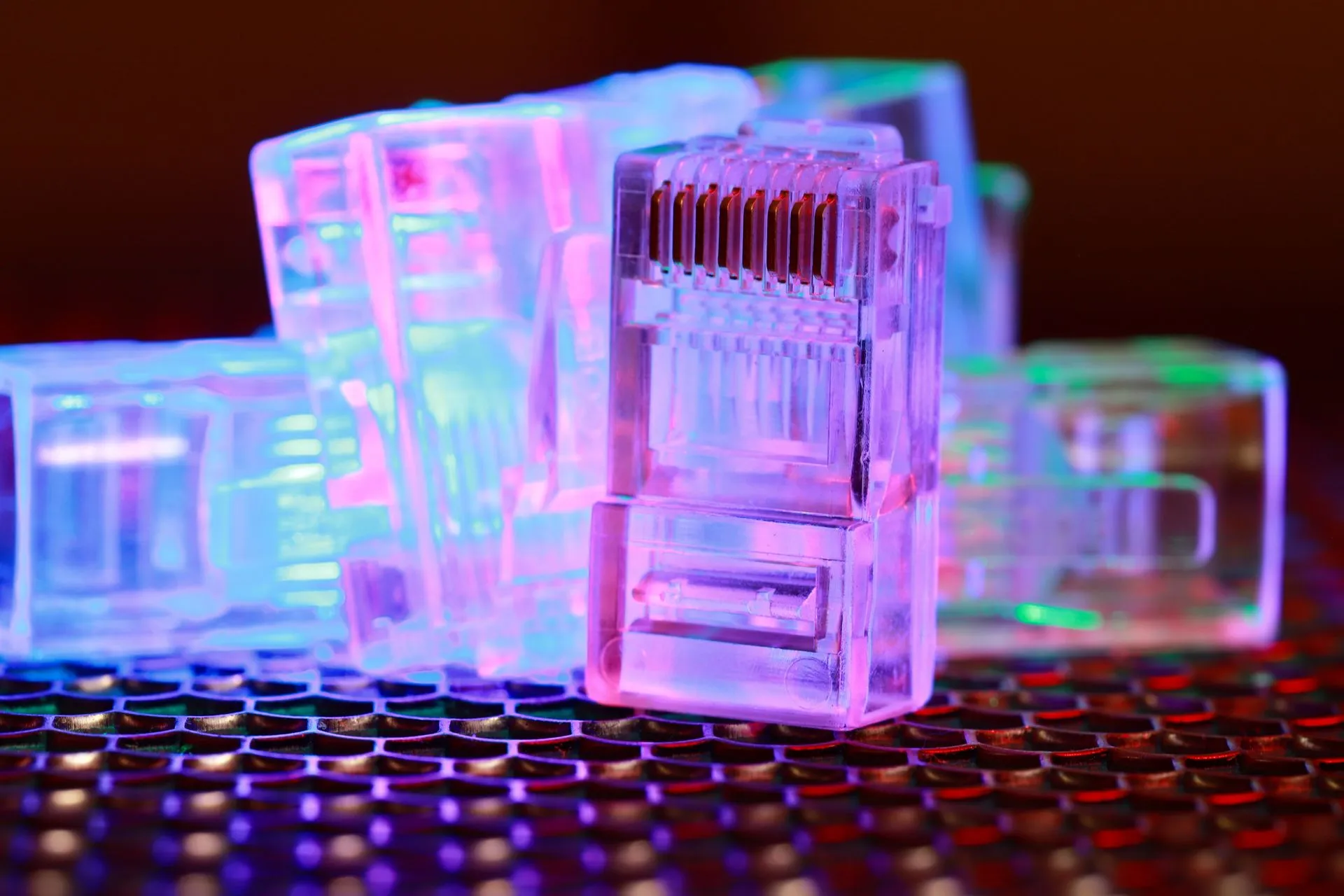 Vibrant close-up of network cable connectors with colorful lighting, illustrating Progress Software earnings