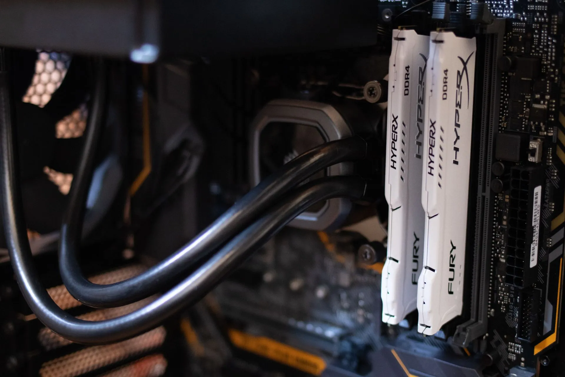 Detailed close-up of computer components including RAM and cables inside a server or high-performance PC, illustrating Reddit API shutdown leads open-web pullback as arXiv and Google