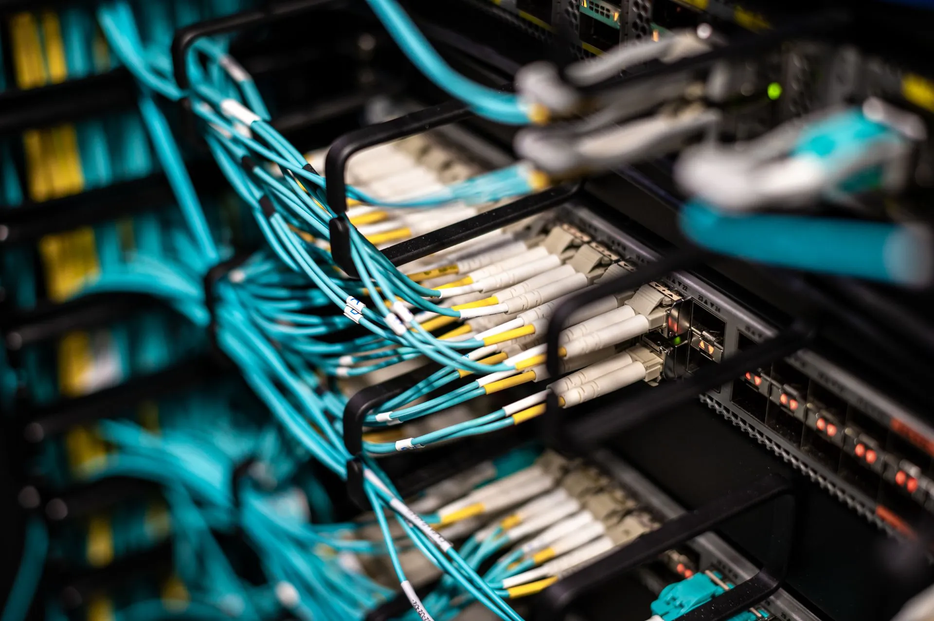 Numerous wires and cables mounted into server patch panel in modern data center, illustrating REDLattice SPAC deal with Bold Eagle values defense cyber firm at $1.25 billion