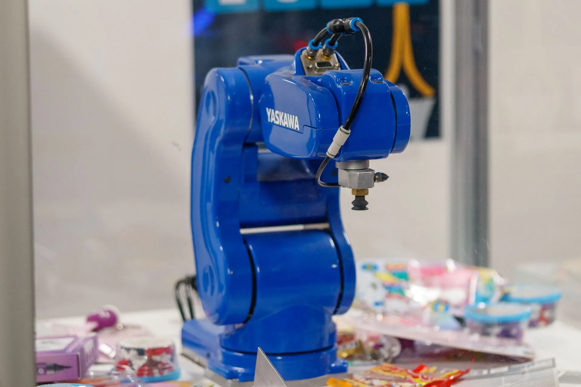 A blue Yaskawa industrial robot arm on display, showcasing advanced technology and robotics, illustrating RobCo valuation tops $1B in a $40M round made up mostly of employee share sales