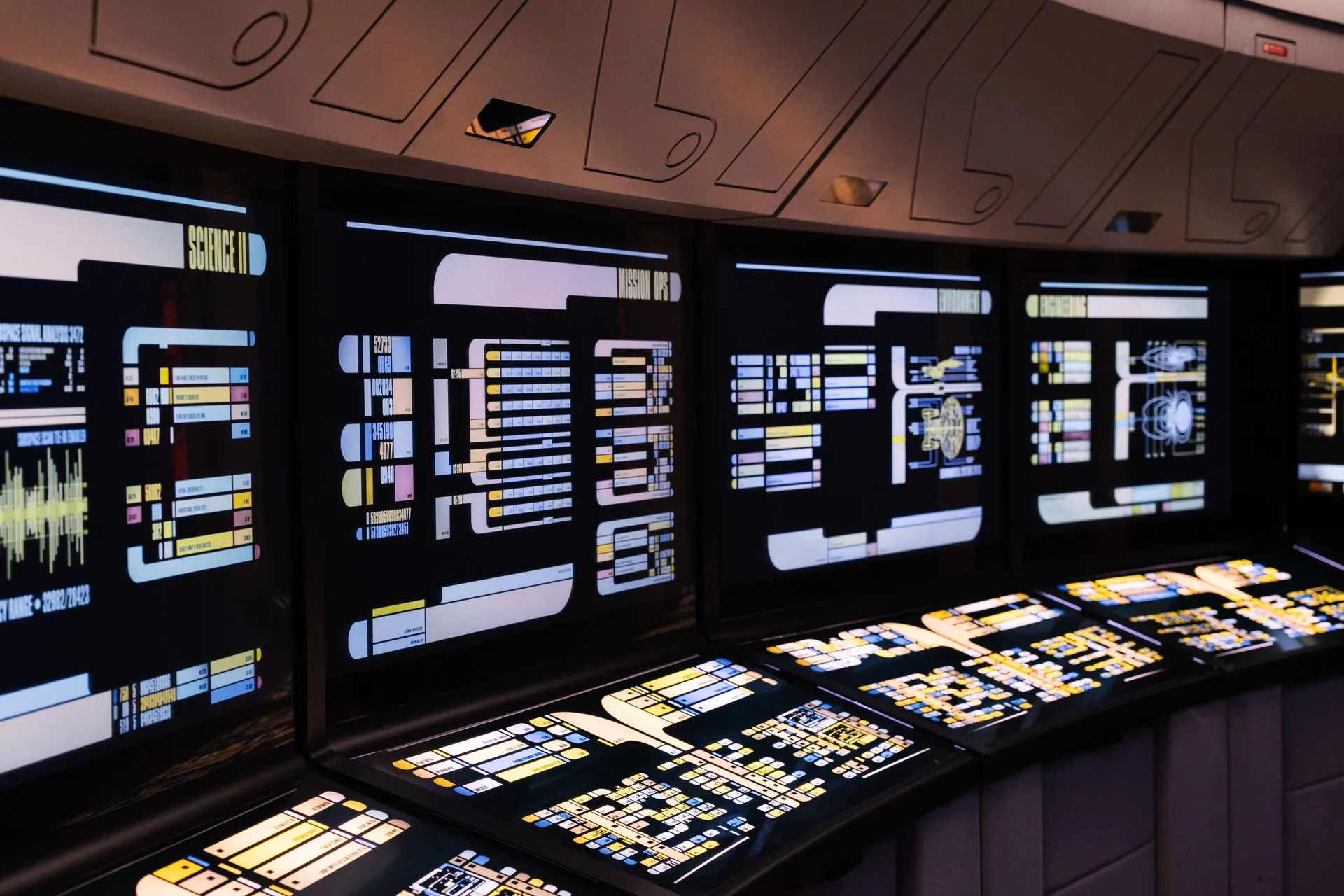 A high-tech command center with illuminated digital screens in a futuristic setting, illustrating Salesforce Agentforce flaws could have let attackers pull CRM data with zero clicks
