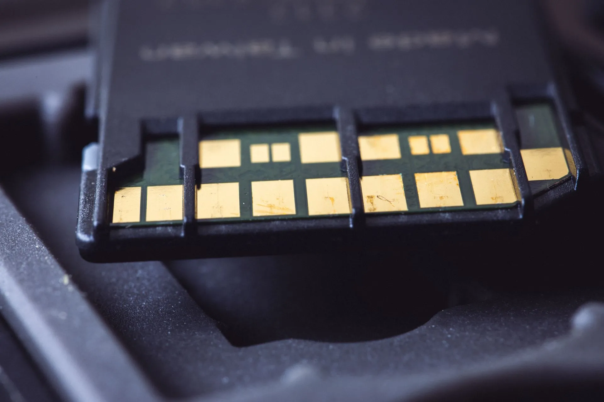 Detailed macro shot of SD card connector pins, highlighting technology and electronics, illustrating Samsung guides to record 107.4 trillion won Q3 operating profit as memory boom