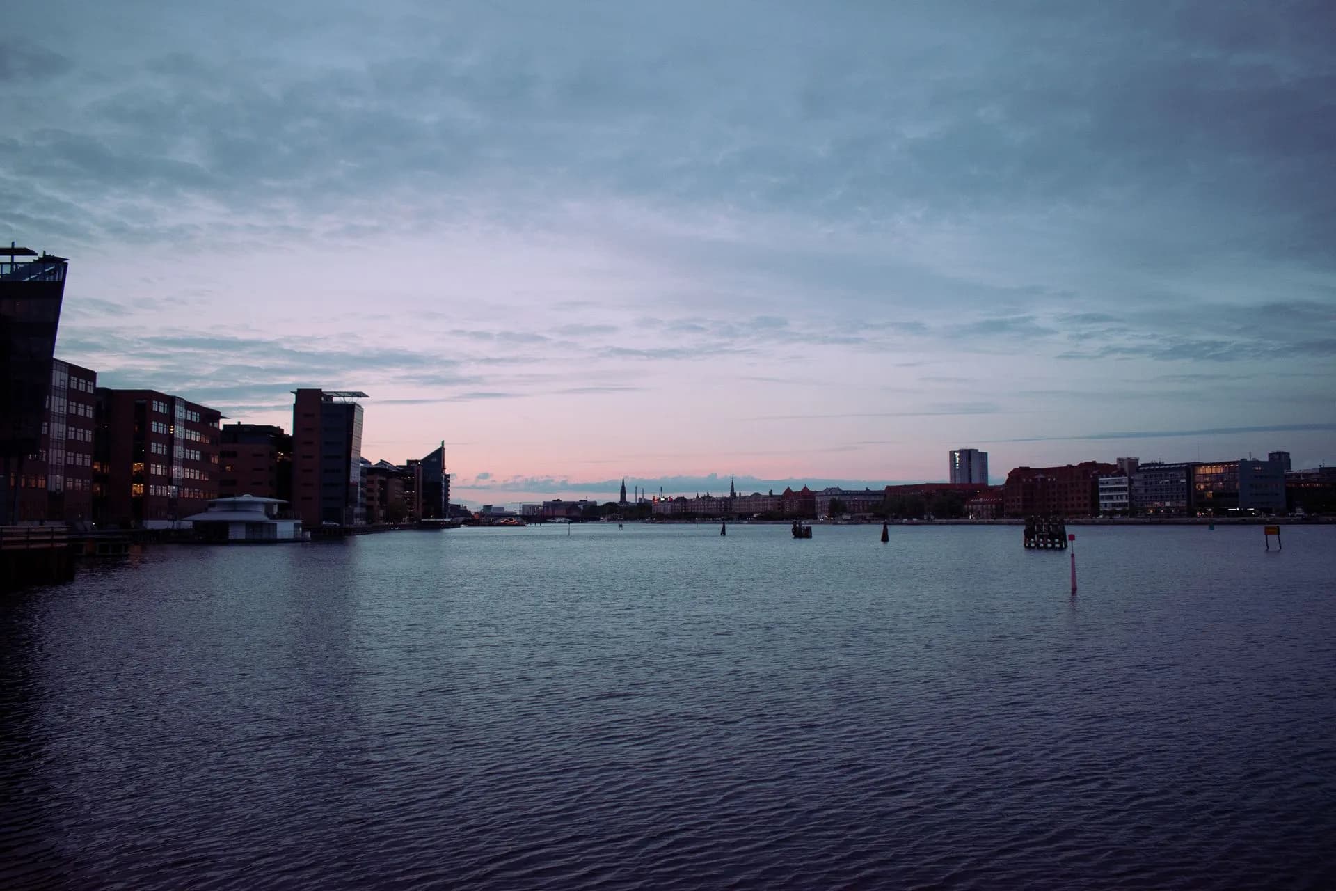 Panoramic view of Copenhagen's waterfront skyline at dusk featuring urban buildings and calm sea, illustrating Seattle ranks No. 4 on Global Cities Index