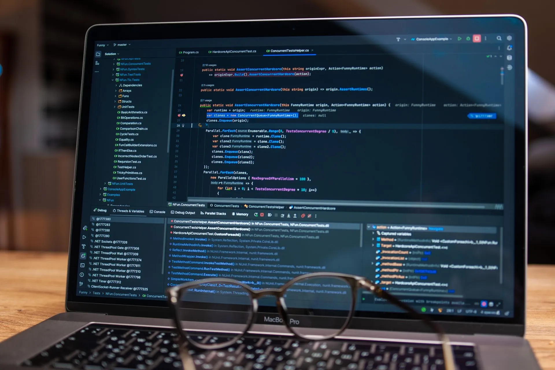 Laptop screen showing debugging software with code, perfect for tech and software development themes, illustrating CrowdSec traces source code leak to ex-employee's laptop as software