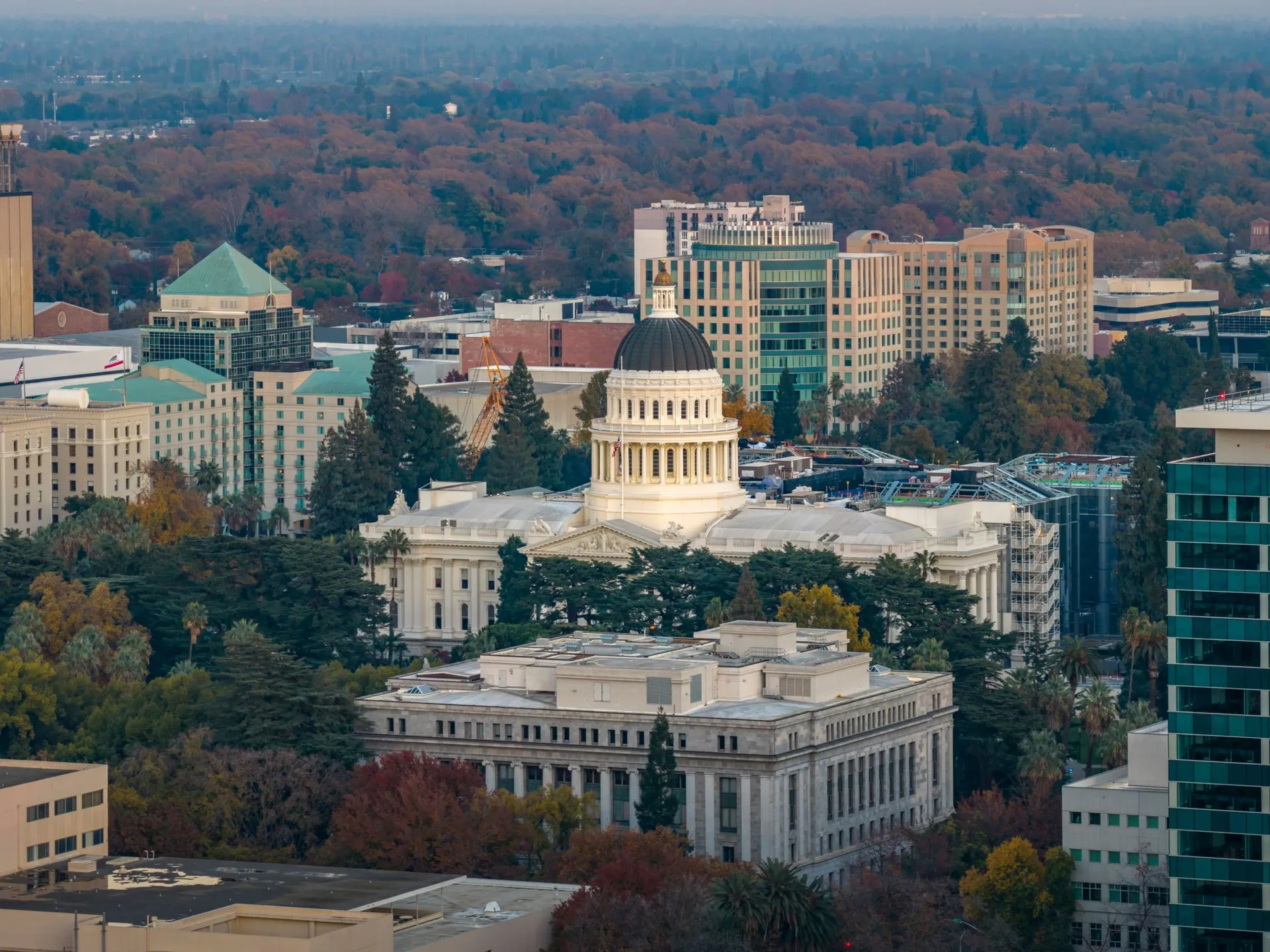 Stunning aerial view of the iconic California State Capitol in Sacramento surrounded by cityscape, illustrating State crypto rules multiply as the Clarity Act stalls