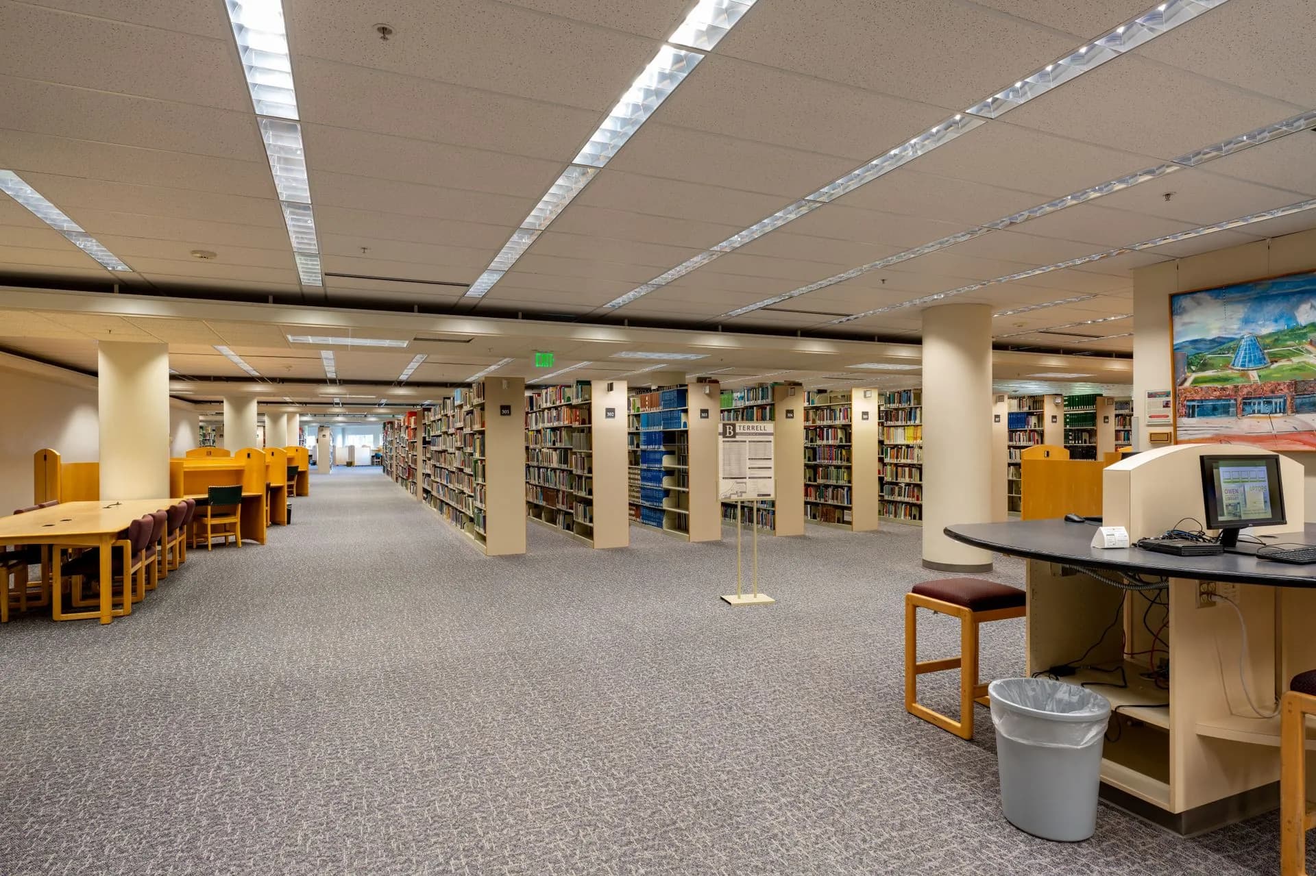 Wide-angle view of a modern library interior at Washington State University, Pullman, illustrating Third Circuit rejects Ross's AI training fair use defense over 2,243 Westlaw headnotes