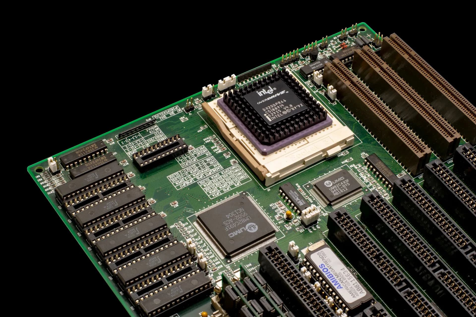 Detailed shot of a vintage motherboard showcasing microprocessor and electronic components, illustrating Thought Machine and AWS claim AI can cut years-long core banking migrations to
