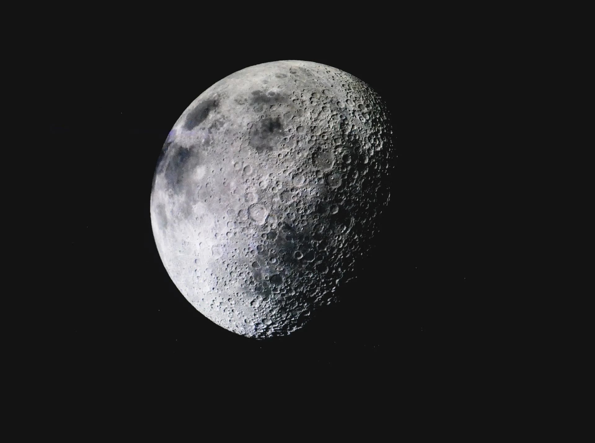 Captivating image of the lunar surface with visible craters against a deep dark sky, illustrating Xona readies six satellites for its Pulsar GPS alternative, built to resist jamming