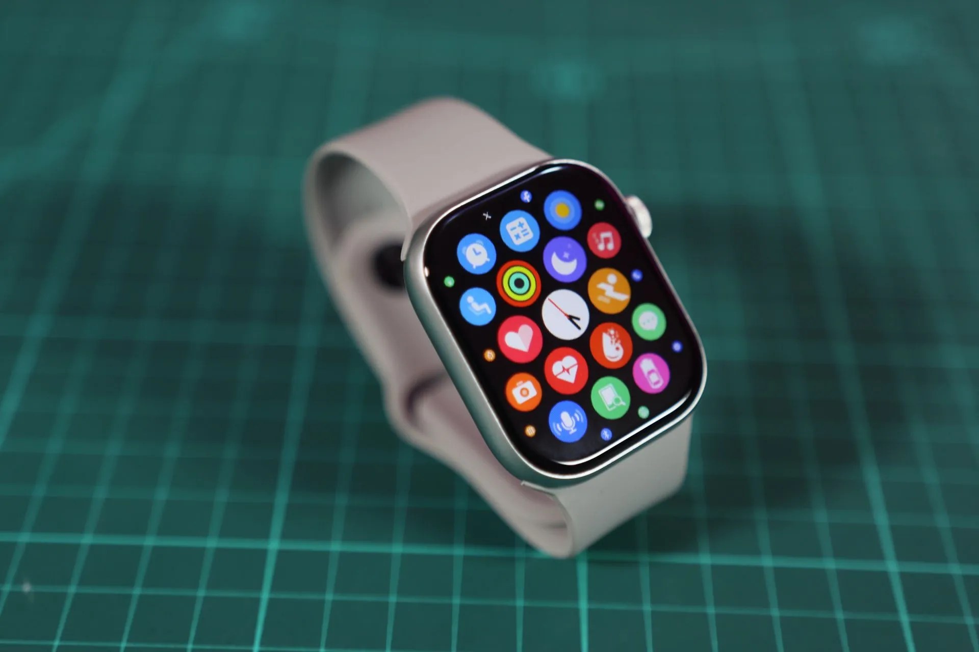 Close-up of a smartwatch showcasing various colorful app icons on its screen, illustrating Cal AI founder Zach Yadegari, 19, raises $10M for Persona, a personal AI assistant