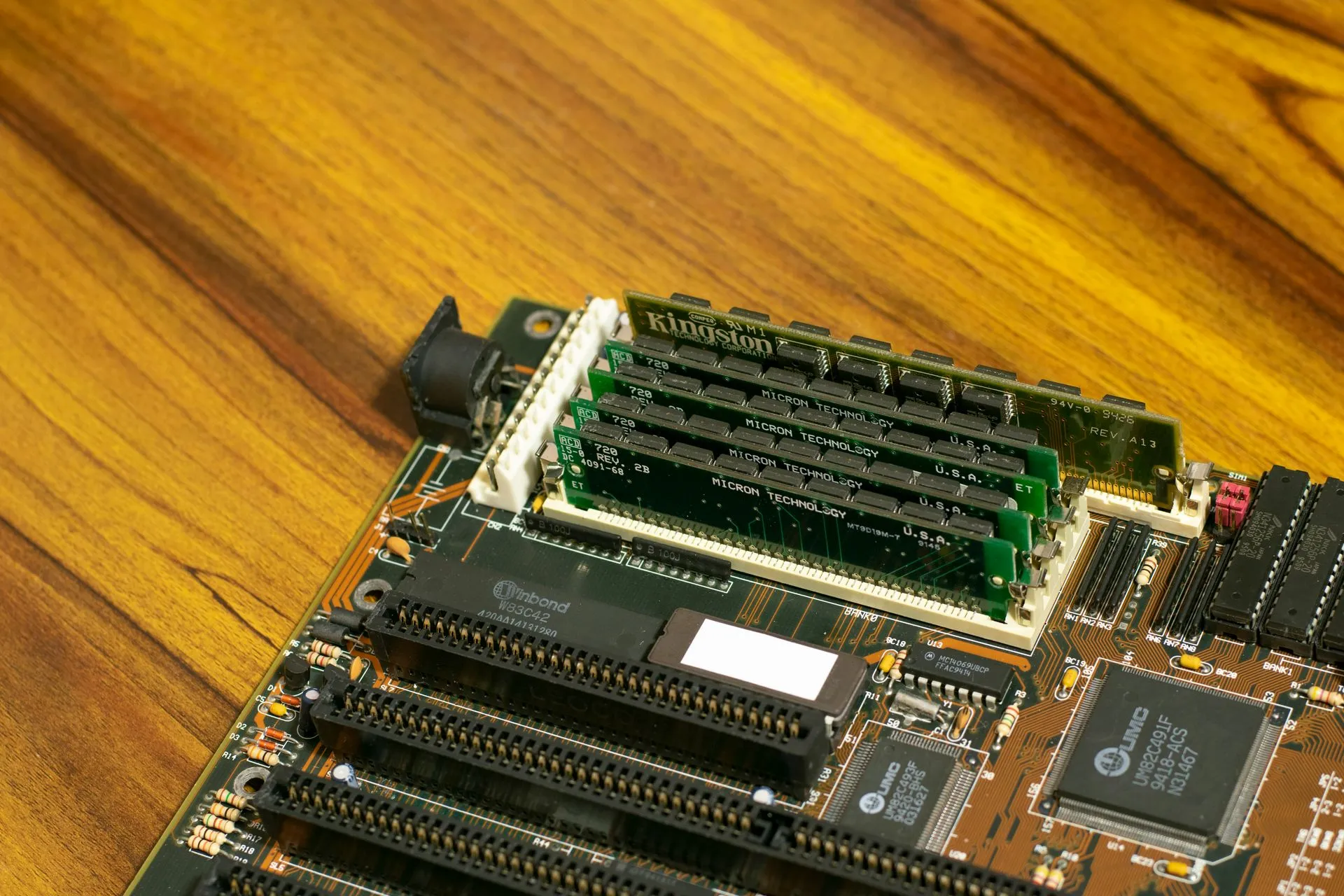 Detailed image of a vintage computer motherboard with RAM sticks, illustrating Micron Q4 revenue jumps to $54.23 billion